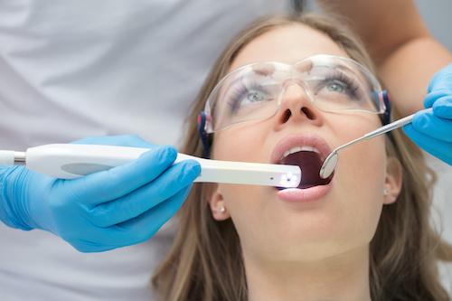 woman receiving dental cleaning | southampton dentist