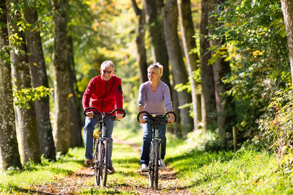 older couple biking | dentist in the hamptons