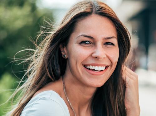 woman with brown hair smiling | cosmetic dentist southampton