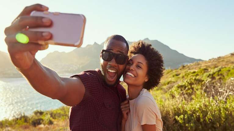 couple hiking and smiling | southampton dentist