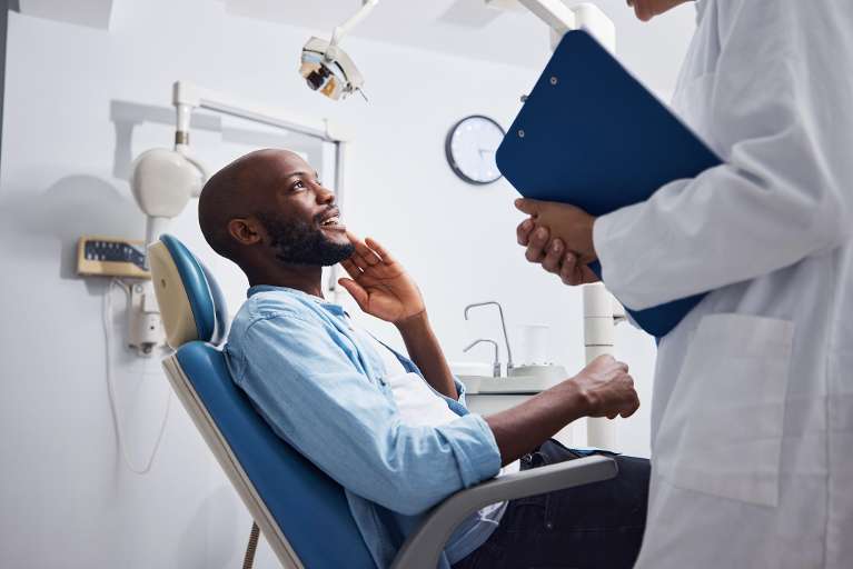 Man suffering from tooth pain in Southampton NY