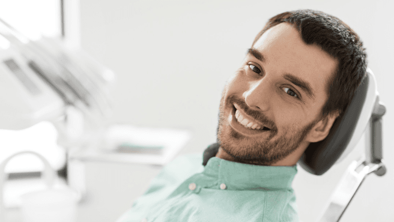 A man patient on a dental chair in Southampton with dental crown