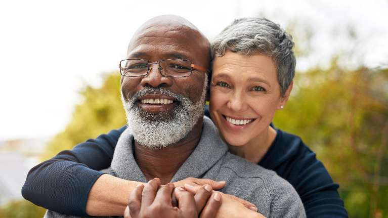 older couple hugging | dentist in the hamptons