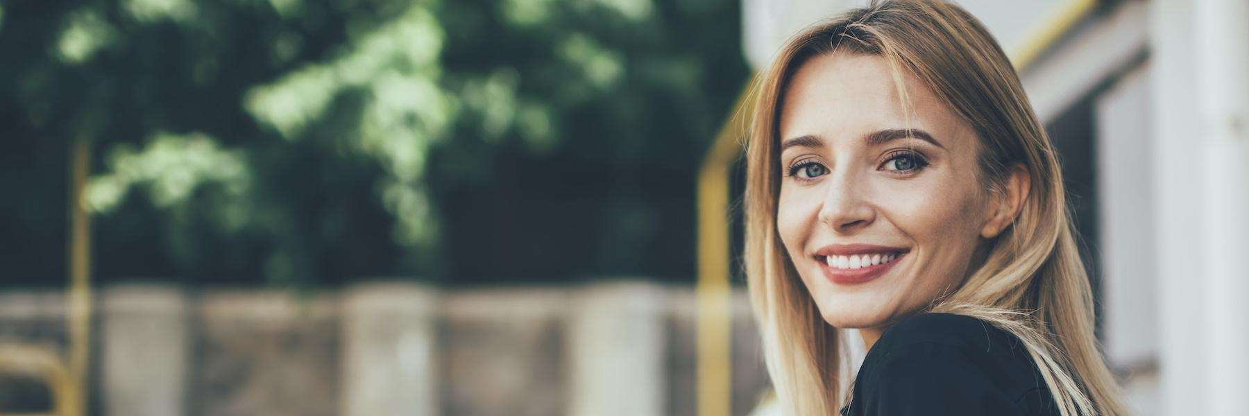 woman outside the cosmetic dentistry clinic in southhampton ny
